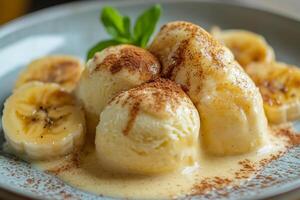 Vanilla ice cream with sliced bananas and cocoa powder topping a custard photo