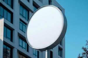Round white empty signage showing on modern building background photo