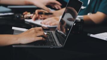 A person typing on a laptop computer video