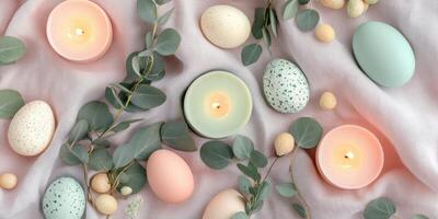 Pastel eggs with eucalyptus and candles arranged for festive spring decor photo