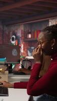 Vertical CTO supervisor in bringing coffee mug to tired worker debugging applications in artificial intelligence focused startup. Team leader helping overworked employee with caffeine beverage, camera A video