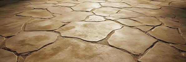 Sunlit stone tiles with natural cracks in earthy tones for flooring concept photo