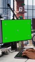 Vertical Programmer coding in startup office using green screen PC, building scalable solutions for businesses. AI industry startup technician leverages machine learning technology on mockup computer, camera A video