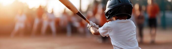 A young player confidently swings a baseball bat with determination while teammates cheer passionately from the background, adding to the electric atmosphere of the game photo