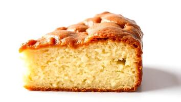 Simple cake slice showing moist texture and golden crust from baking process photo