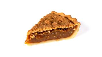 Slice of rich caramel pie with crumbly topping on a plain surface photo
