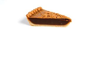 Chocolate pie slice with crumb topping on a plain surface photo