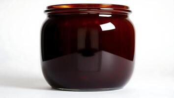 Dark jar filled with rich substance on a simple background photo
