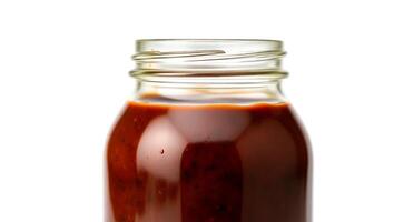 Jar of thick barbecue sauce ready for grilling and summer cookouts at home photo