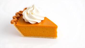 Pumpkin pie slice with whipped cream on top ready to be enjoyed photo