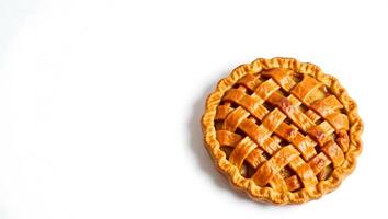 Freshly baked apple pie with a classic lattice crust on a plain background photo