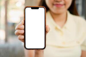 Close-up of a woman showing a smartphone with a blank screen, perfect for app or website mockups. photo