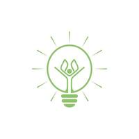 A green light bulb with a hand inside it vector
