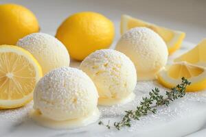 Lemon ice cream scoops melting on marble surface with fresh lemons and thyme sprig photo