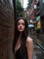 Woman standing in alleyway during rain photo