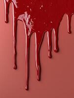 Red paint dripping down a wall, creating an abstract design photo