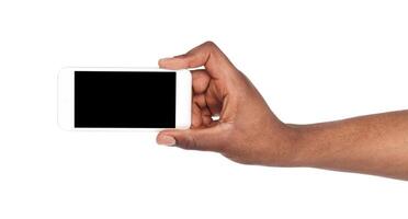 Hand holding mobile smart phone with blank screen, isolated on white background. Copy space for advertisement of mobile app, mockup photo