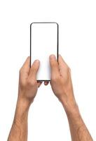 Man holding blank modern smartphone with two hands, texting or sending message over white background with copy space photo