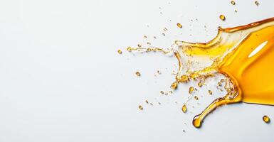 Honey is splashing dynamically across a clean, white background, showcasing its golden color and liquid form. photo