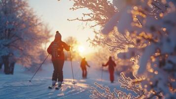 Skiers glide through a snow covered trail at sunset, surrounded by frost covered trees and a glowing orange sky. A serene winter atmosphere envelops the scene. photo