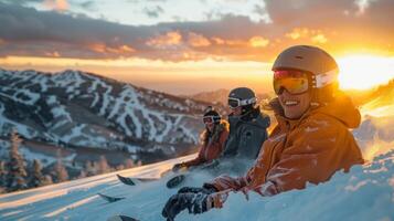 Group of skiers relaxes on a snowy slope, sharing laughter as the sun sets behind distant peaks, creating a warm glow in the early evening sky. photo