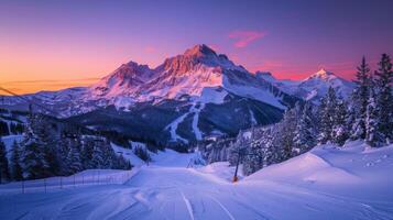 Snow covered slopes and evergreen trees create a picturesque winter wonderland at sunset, highlighting the rugged peaks in the background with vibrant colors. photo