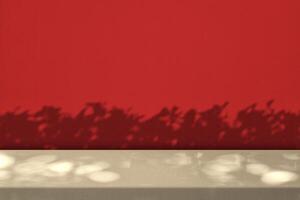 Empty Table with Leaves Shadow on Red Wall Background photo