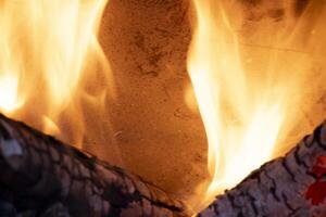 A burning flame with charcoals in the stove photo