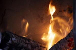 A burning flame with charcoals in the stove photo