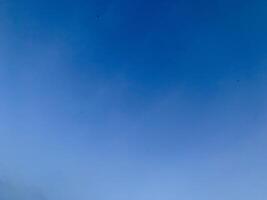 A view of a bright blue sky with white clouds, suitable for the background photo