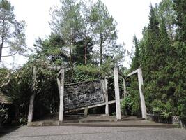 a large wooden structure with a sign on it photo
