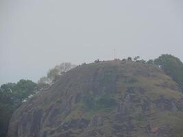 a group of people on top of a mountain photo