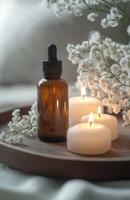 Essential oils and candles on a tray photo