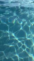 Mesmerizing water ripples creating dancing light patterns in a pool video