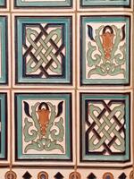 A close up of a tile with a design on it photo