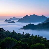 the sunrise over the mountains and fog photo