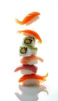 pile of various things of sushi on a white background photo