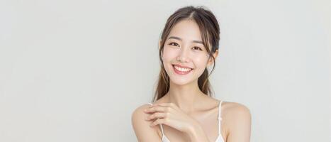Smiling young woman with flawless skin posing against a pastel background5 photo