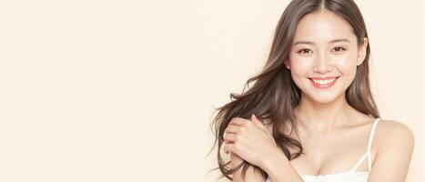 Smiling young woman with flawless skin posing against a pastel background2 photo
