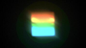 4K seamless loop of abstract animation of a rotating rectangle of light with orange, green, and blue sections video