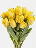 A delightful bouquet of yellow tulips showcases their intricate petals and lush green leaves. The flowers exemplify the beauty of spring, symbolizing joy and warmth in any setting photo