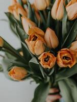 A close-up of a beautiful bouquet filled with bright yellow tulips enhances the ambiance with its vibrant colors and delicate petals, bringing joy and freshness to any setting photo