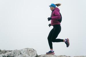 Trail Runner in Misty Mountain Landscape photo