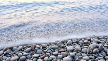 Smooth Grey Pebbles on a Calm Beach Shore photo
