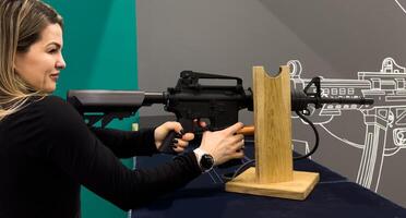 Shooters practicing tactical shooting in a modern indoor gun range. photo