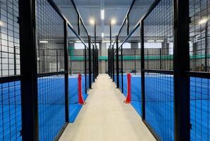 Padel court with lines and net indoor photo