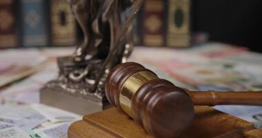 The shows images of justice, featuring Lady Justice and symbols video