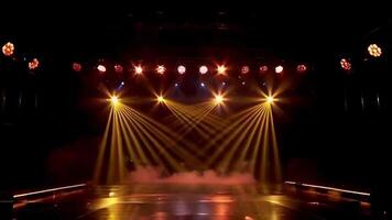 a high-energy stage background animation featuring synchronized golden spotlights, mist effects, and reflections on a glossy floor. The lights should pulse and move rhythmically video