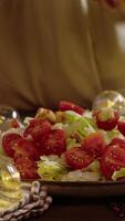 Caesar salad with cherry tomatoes and iceberg lettuce, generously topped with croutons. Dry pieces of white bread are added to fresh salad. video