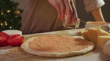 Pizza is prepared from raw dough that is covered with tomato sauce and sprinkled with natural ingredients, such as basil and pepper, add delicious, spicy flavor. traditional Italian pizza video